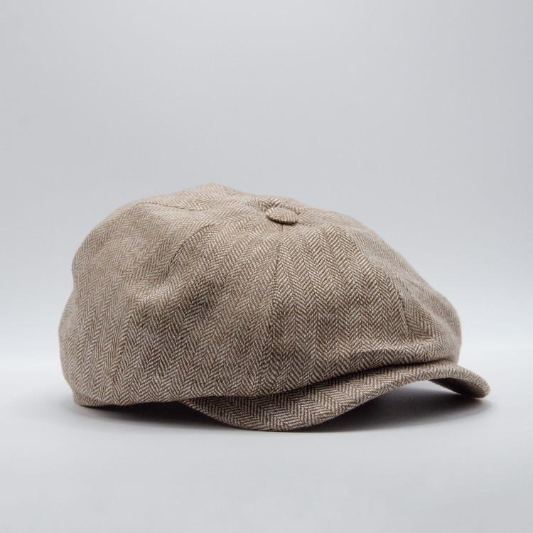 Wigéns News Boy Classic Cap i beigemelerad fiskbensväv