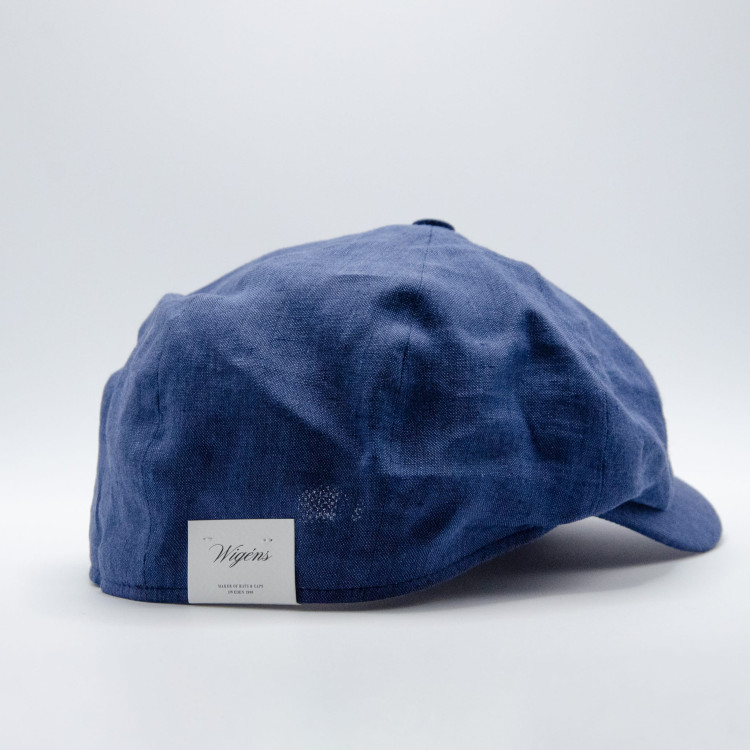 Sidovy av blå Wigéns News Boy Classic Cap med etikett